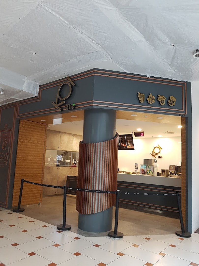 The inviting shop front of KOI Thé, a popular bubble tea establishment, with its counter visible.