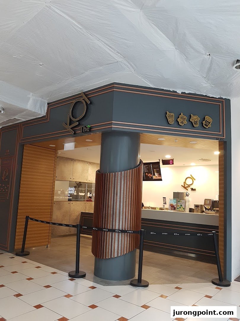The inviting shop front of KOI Thé, a popular bubble tea establishment, with its counter visible.