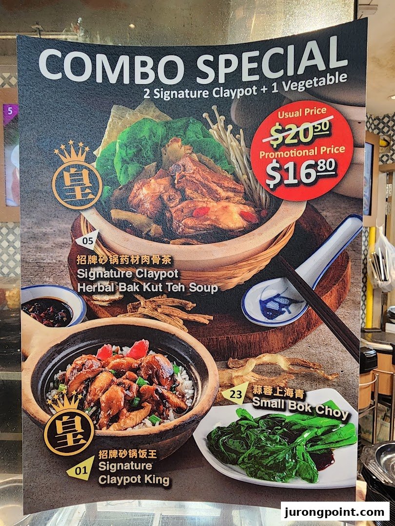 A menu board displaying a combo special featuring claypot dishes and a vegetable.