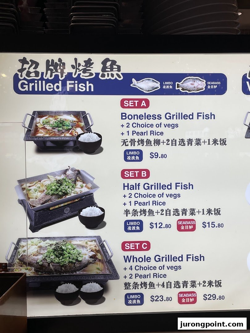 A menu board displaying various grilled fish sets with different fish types and accompaniments.