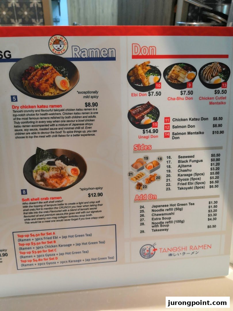 A detailed menu board for Tanoshi Ramen, featuring ramen, donburi, sides, and set meals.
