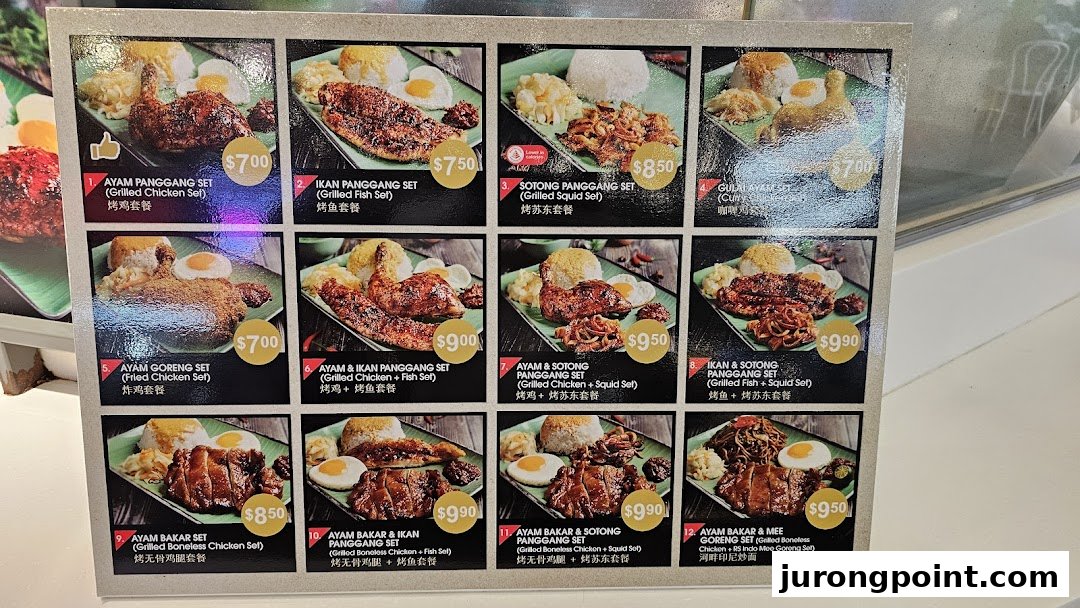 A vibrant menu board displaying various grilled and fried Asian food sets with prices and images.