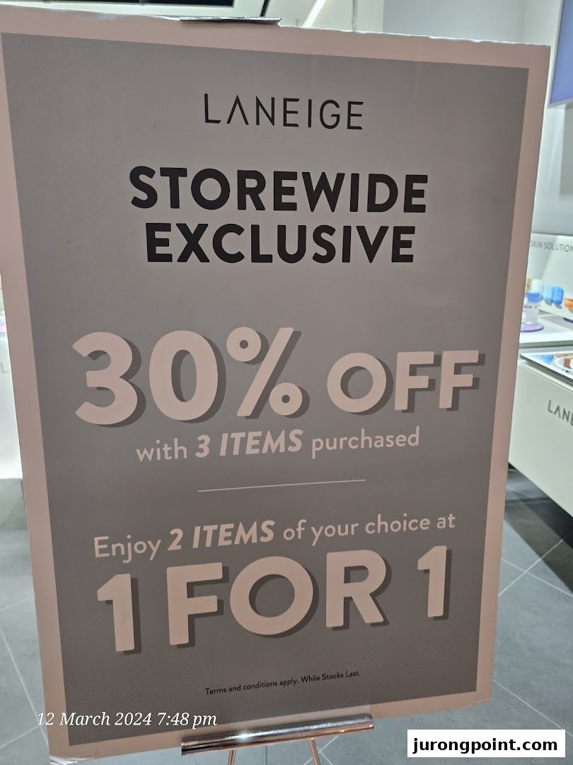 A promotional sign for LANEIGE displaying storewide exclusive offers including 30% off and 1-for-1 deals.