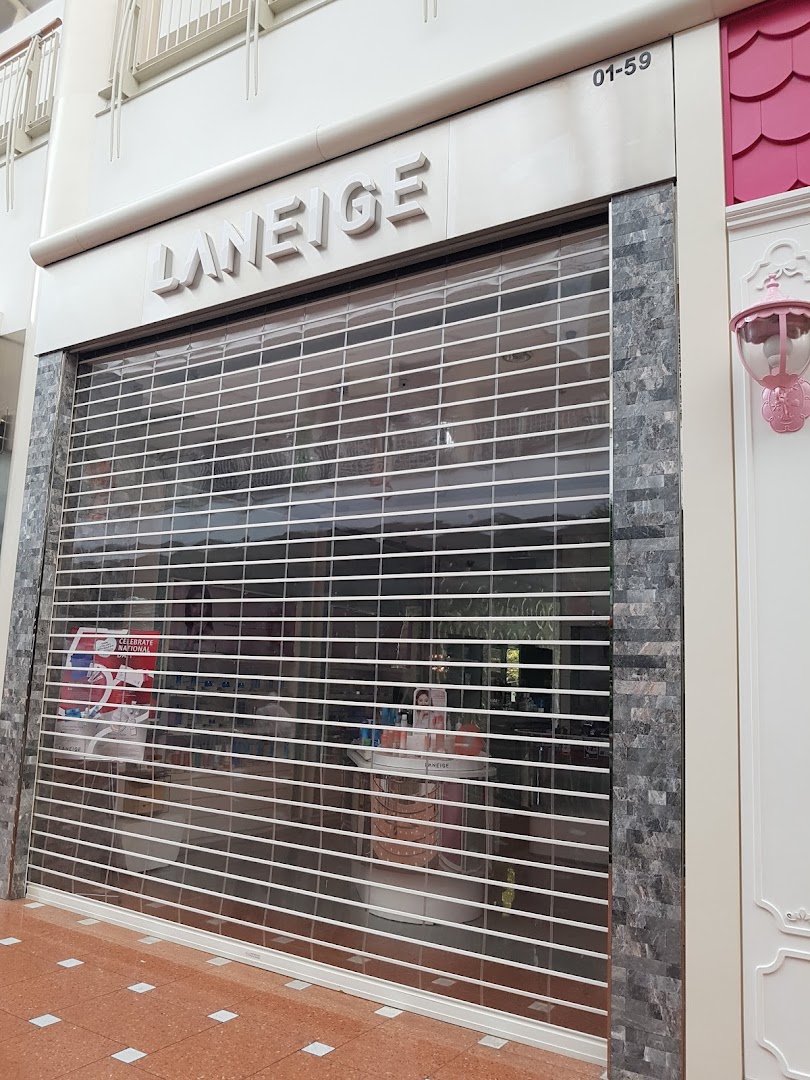 The exterior of the LANEIGE beauty shop with its security shutter closed.