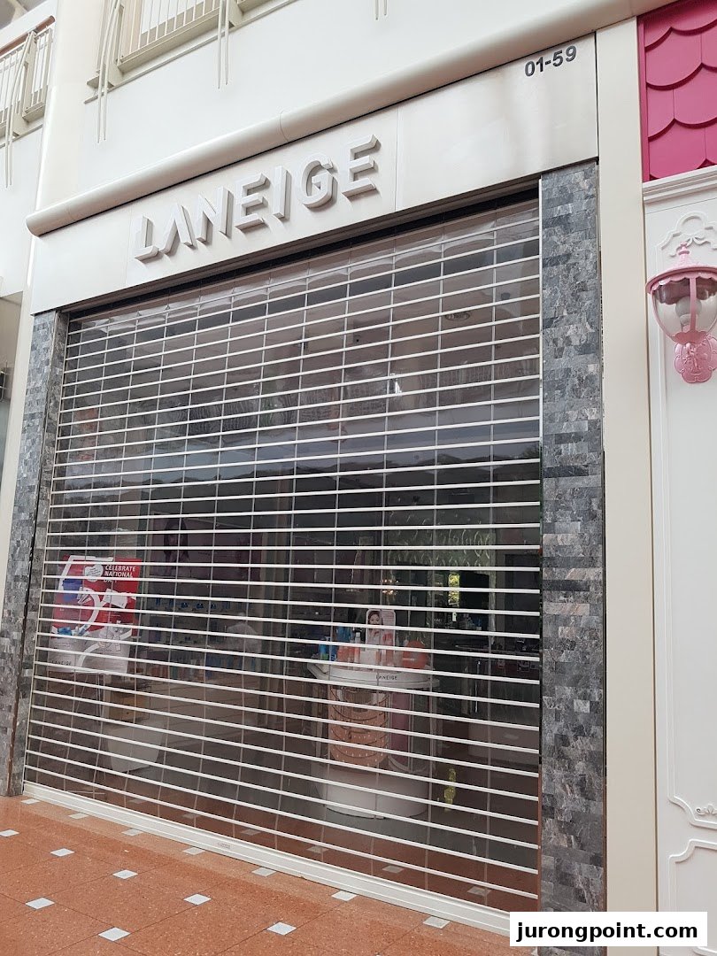 The exterior of the LANEIGE beauty shop with its security shutter closed.