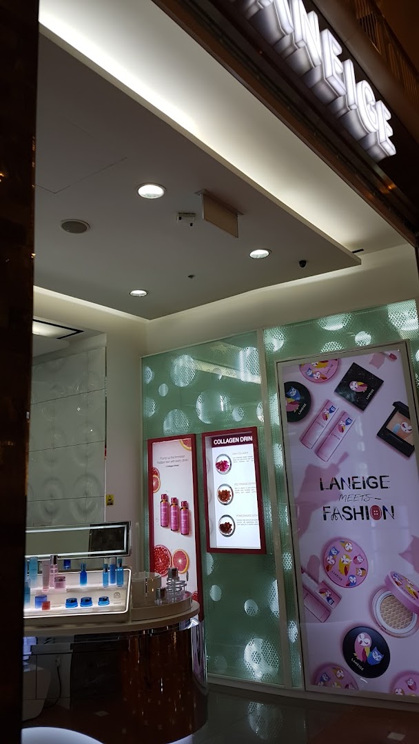 Interior view of a LANEIGE beauty store showcasing skincare products and promotional displays.