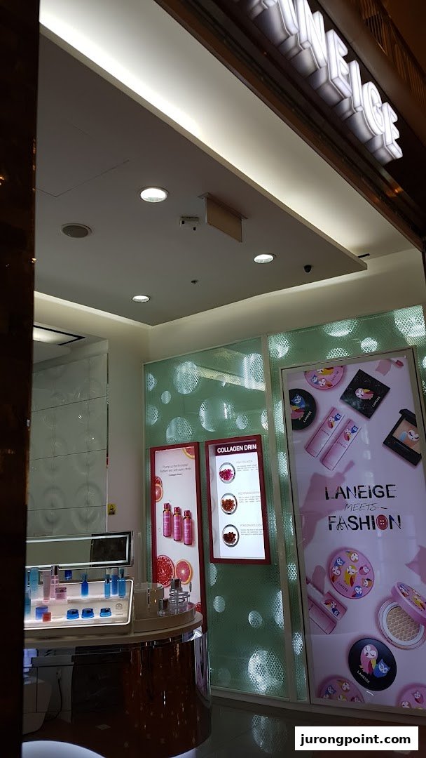 Interior view of a LANEIGE beauty store showcasing skincare products and promotional displays.