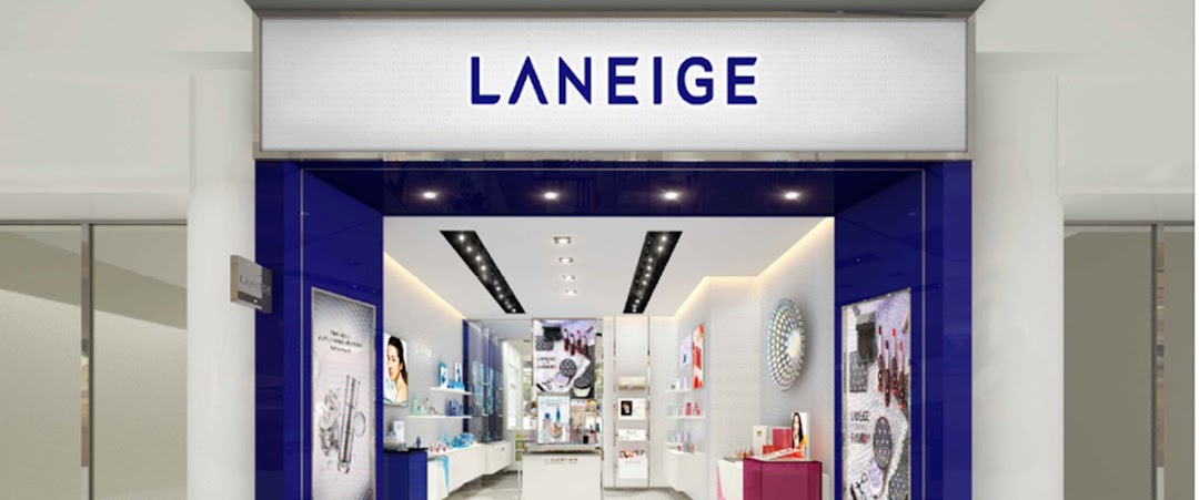 The bright and inviting storefront of LANEIGE, showcasing its prominent blue and white branding.