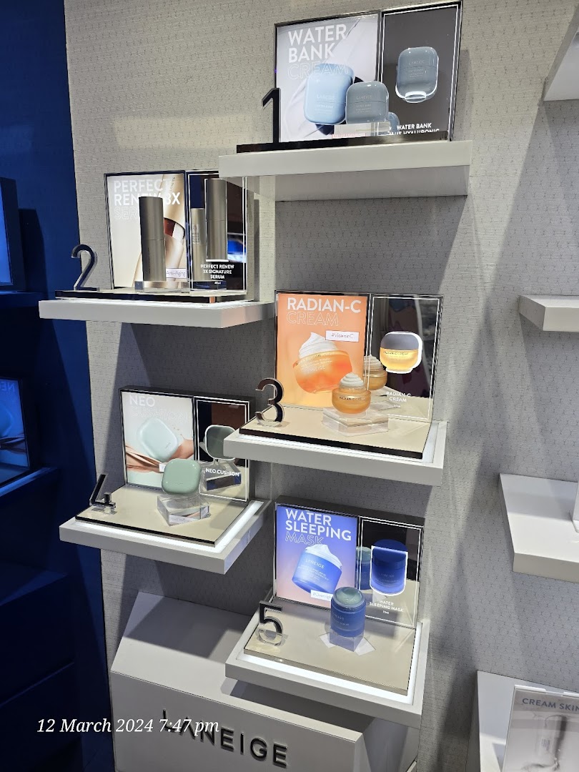 A vibrant display of LANEIGE skincare products, including Water Bank, Perfect Renew, Radian-C, Neo Cushion, and Water Sleeping Mask.