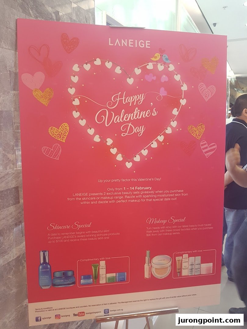 A vibrant pink promotional poster for Laneige, featuring Valentine's Day beauty specials and offers.