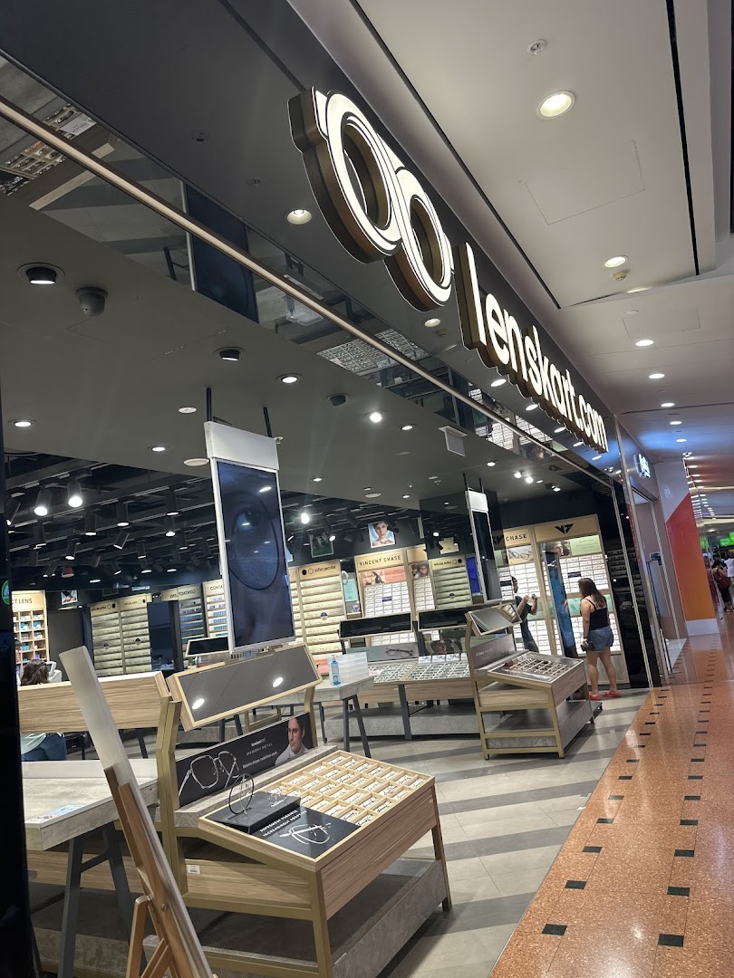 The Lenskart store entrance showcasing its illuminated logo and a glimpse of the wide range of eyewear inside.