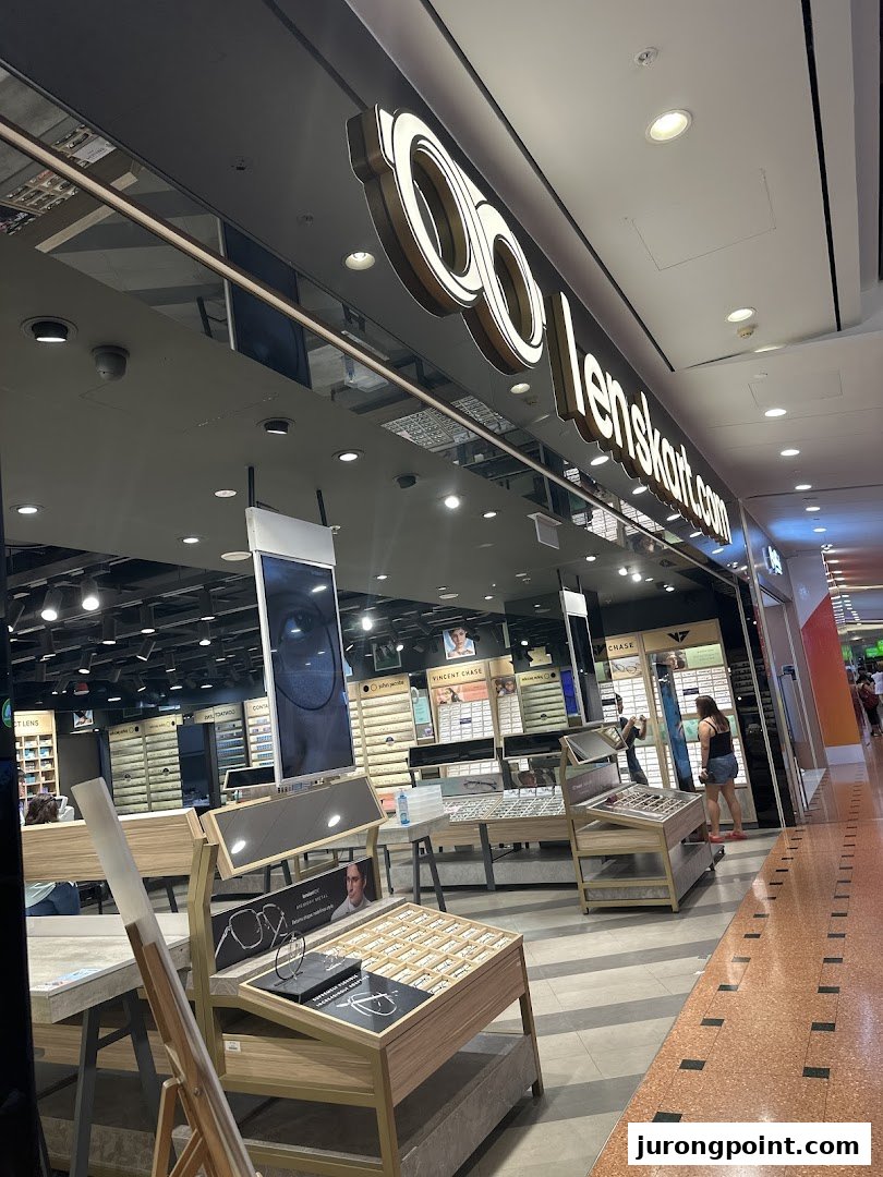 The Lenskart store entrance showcasing its illuminated logo and a glimpse of the wide range of eyewear inside.