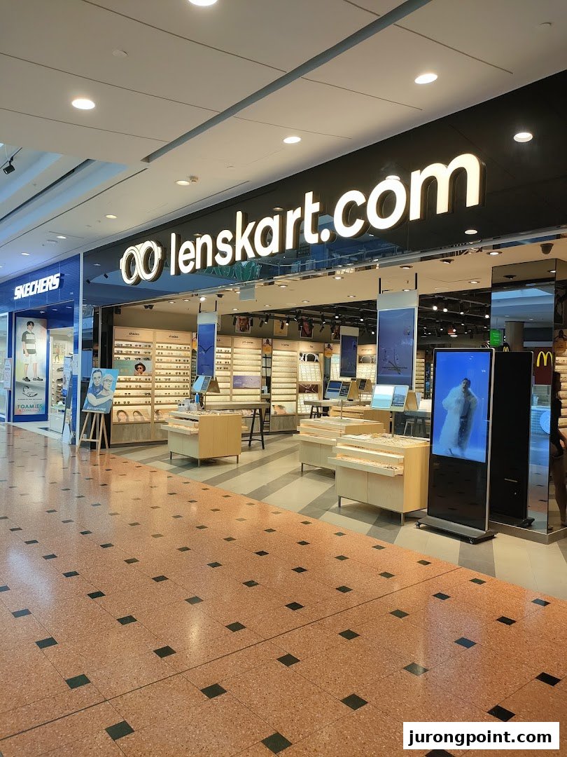 The Lenskart storefront in a mall, displaying a wide range of eyeglasses and a digital screen.