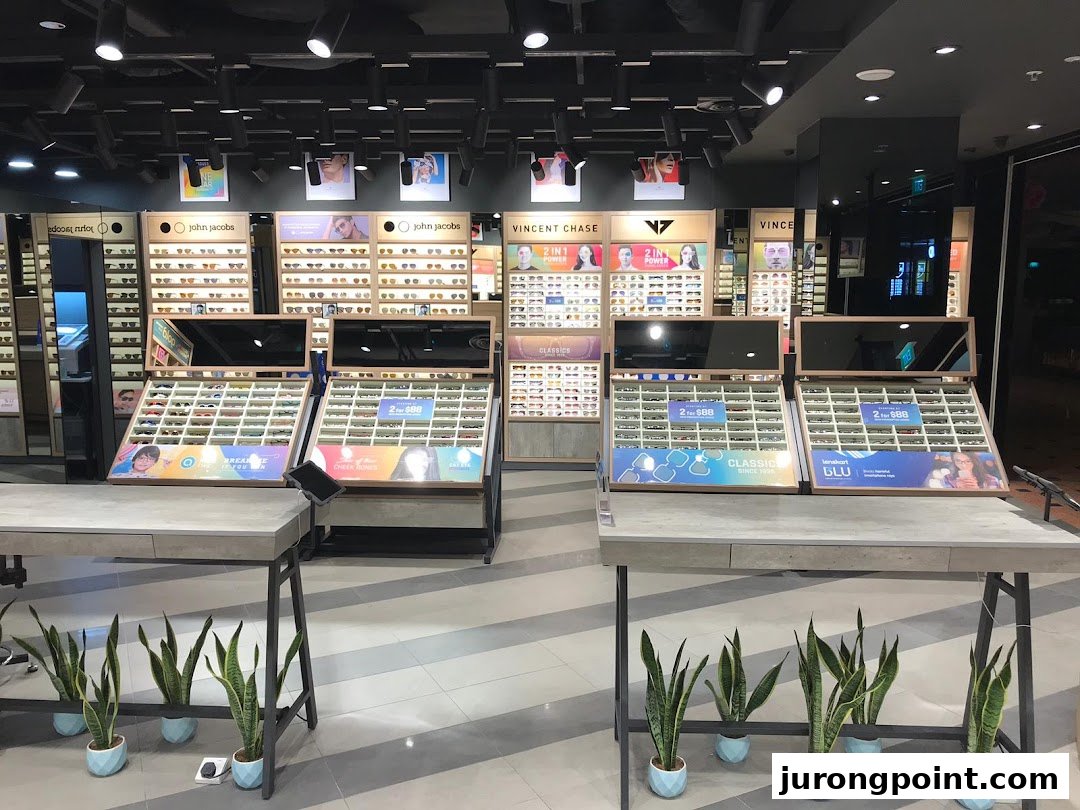 An interior view of Lenskart showcasing various eyewear displays, including glasses and sunglasses, with promotional signage.