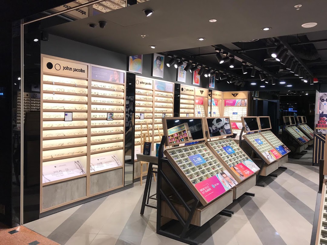 Interior view of a Lenskart store showcasing a wide array of eyeglasses on modern display units.