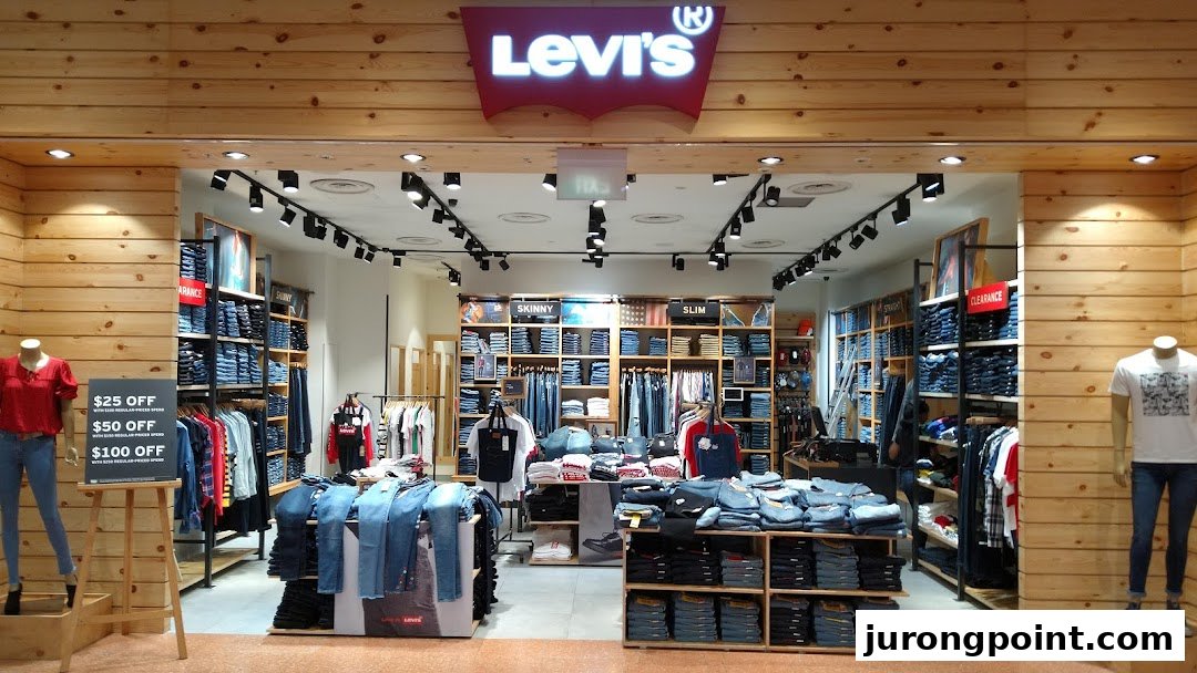 The image shows the well-lit entrance of a Levi's store with wooden paneling and denim displays.