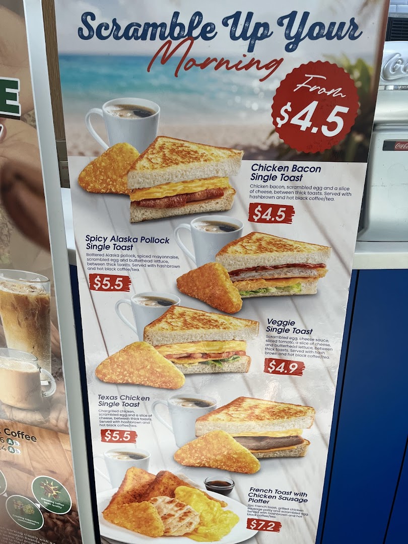 A vibrant breakfast menu board featuring various toast and platter options with prices.