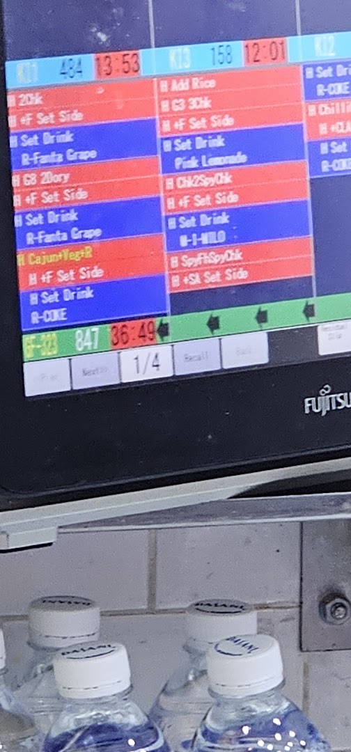 A digital kitchen display system shows food orders and preparation times at Long John Silver's.