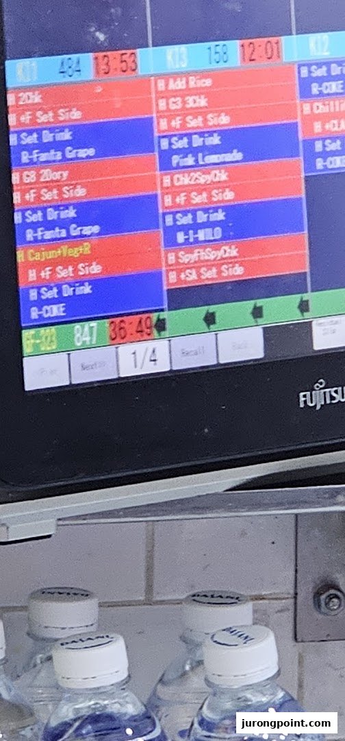 A digital kitchen display system shows food orders and preparation times at Long John Silver's.