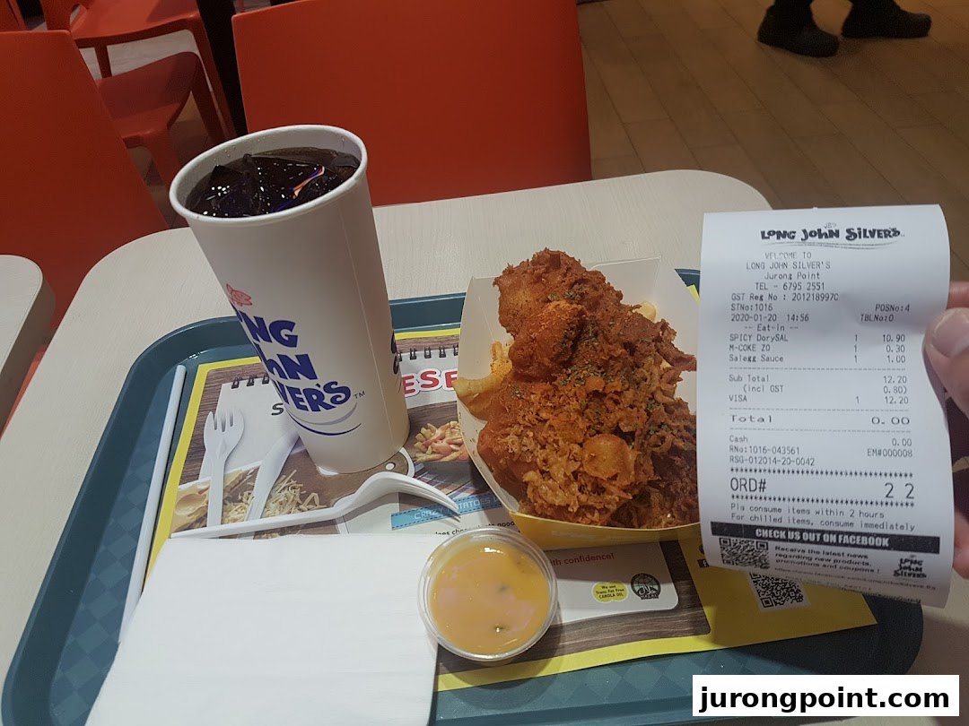 A delicious Long John Silver's meal with fried fish, fries, a drink, and a receipt.