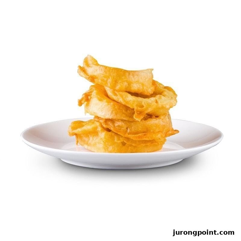 A stack of golden-brown, crispy fried rings, likely onion rings, on a white plate.