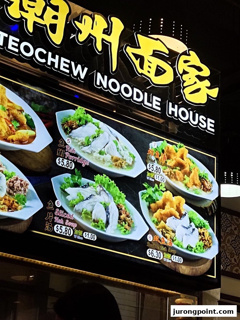 A bright menu board showcasing various fish dishes from Teochew Noodle House.