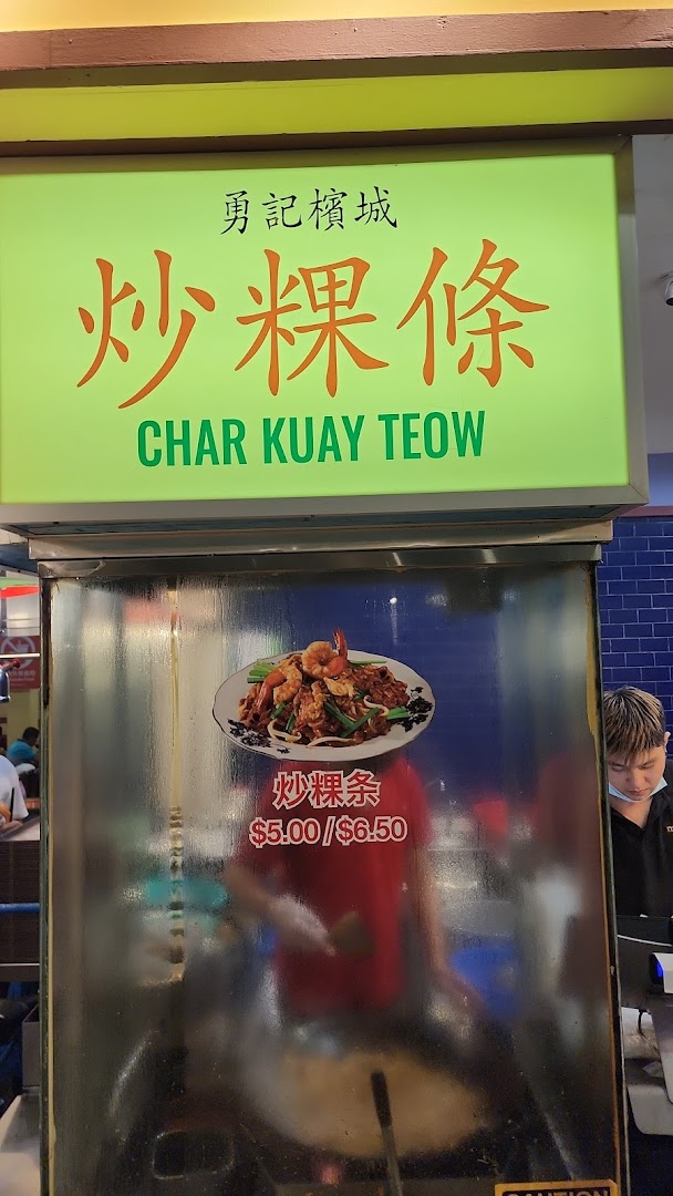 A food stall sign displaying Char Kuay Teow with its image and prices at Malaysia Boleh!.