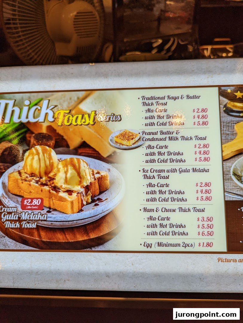 A vibrant menu board showcasing various thick toast options with prices and accompanying drinks.