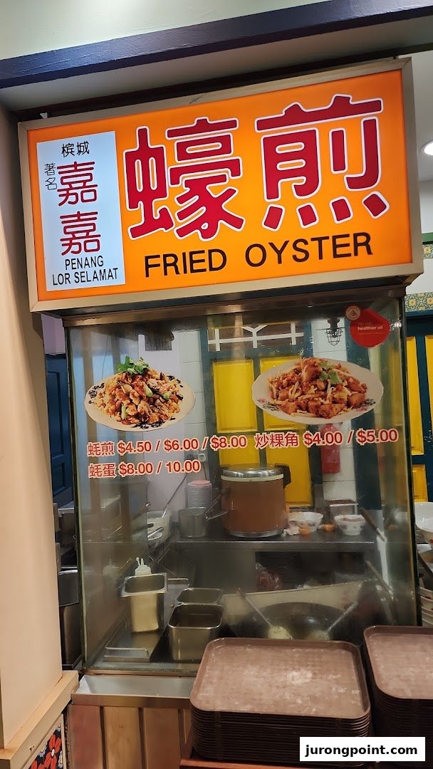 A food stall sign for 'Fried Oyster' with product photos and a price list for various dishes.
