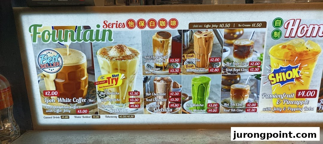 A brightly lit menu board displaying a variety of hot and iced beverages, including coffee, tea, chocolate, and fruit drinks.