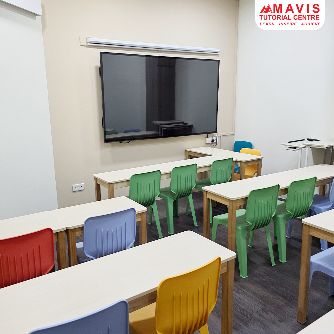 A modern classroom at Mavis Tutorial Centre with colorful chairs, desks, and a large interactive screen.