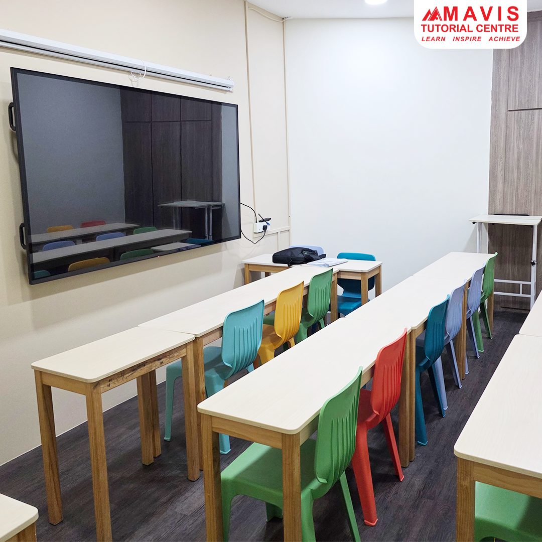 A modern classroom at Mavis Tutorial Centre with colorful chairs and a large display screen.