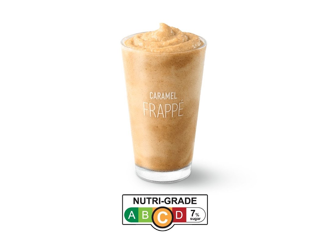 A refreshing McDonald's Caramel Frappé beverage with a Nutri-Grade C label, indicating 7% sugar.