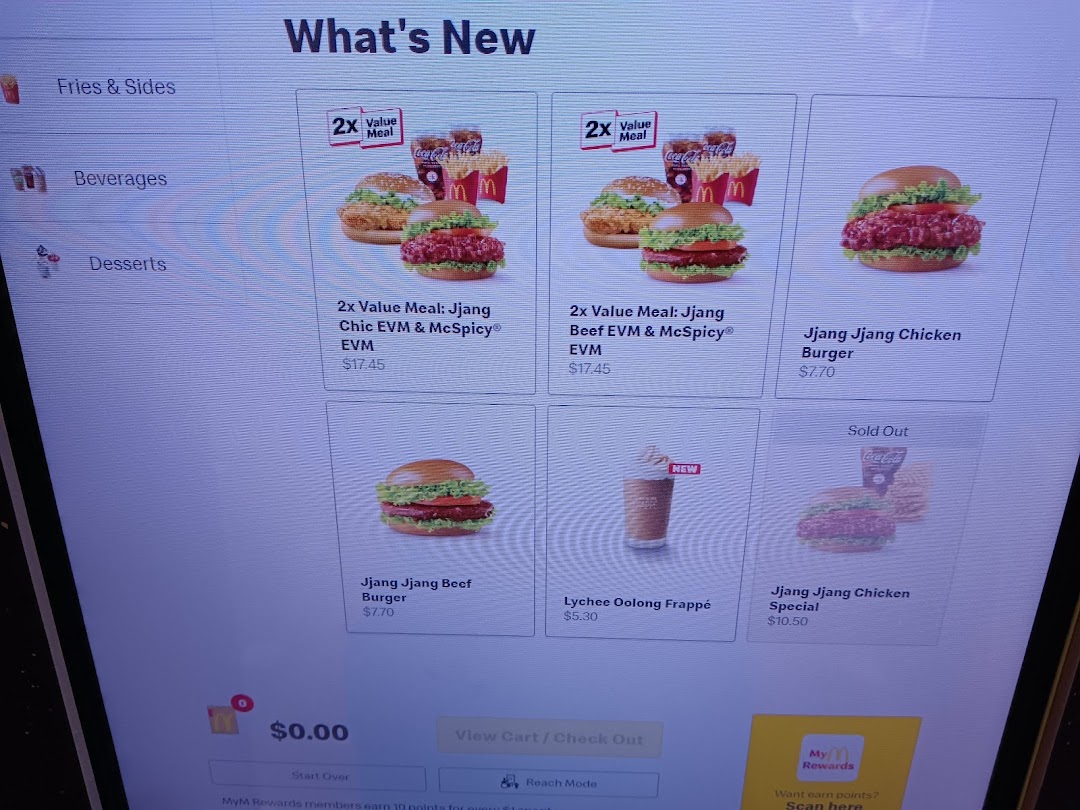 A digital self-service menu screen at McDonald's displaying 'What's New' items and prices.