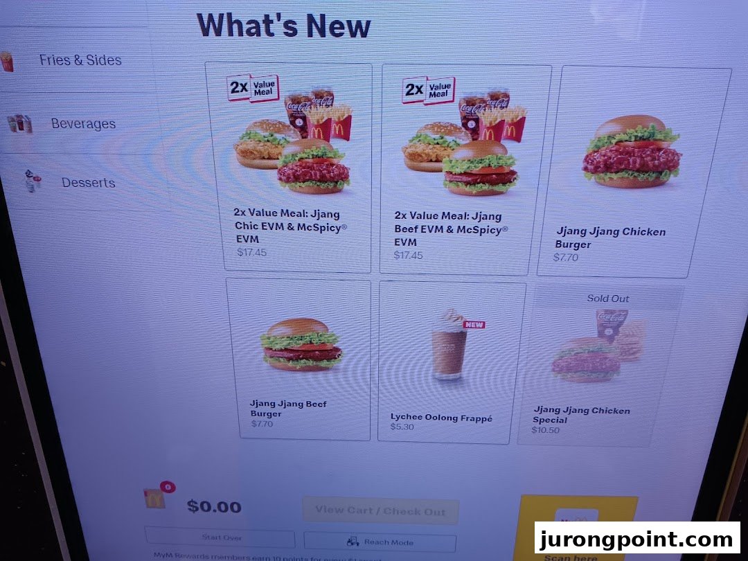 A digital self-service menu screen at McDonald's displaying 'What's New' items and prices.