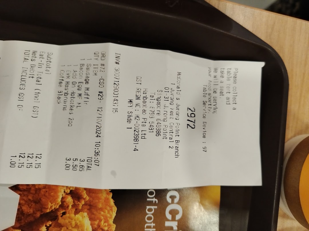 A detailed McDonald's receipt showing a breakfast order with items, prices, and branch information.