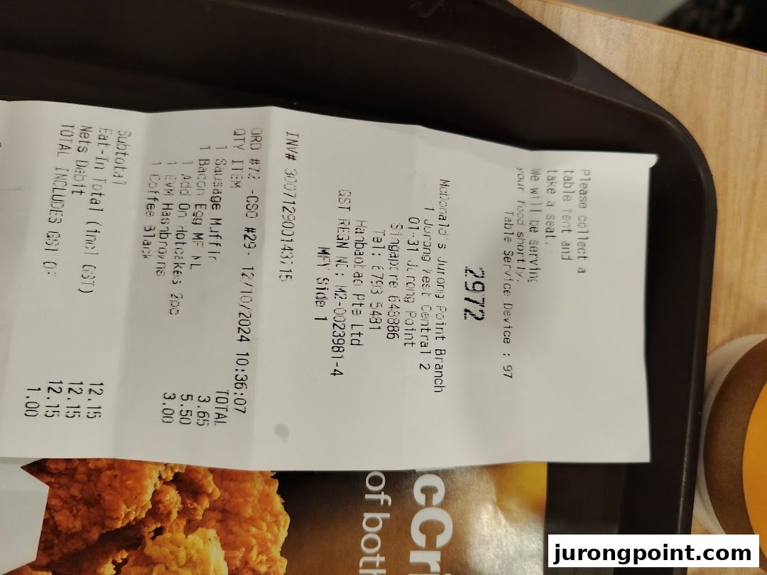A detailed McDonald's receipt showing a breakfast order with items, prices, and branch information.