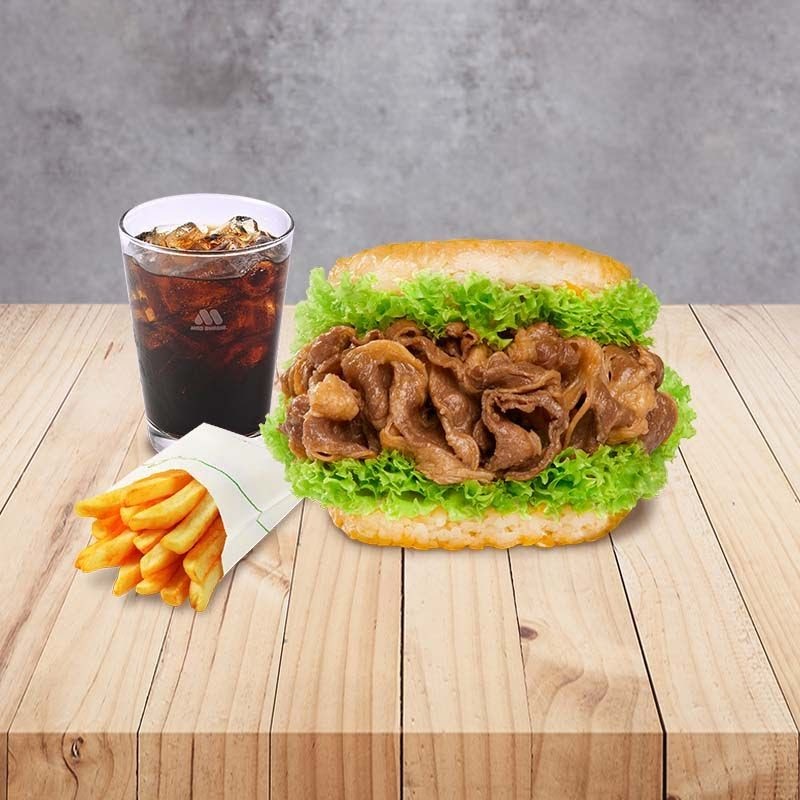 A delicious MOS Burger meal featuring a rice burger with beef, fresh lettuce, fries, and a refreshing drink.
