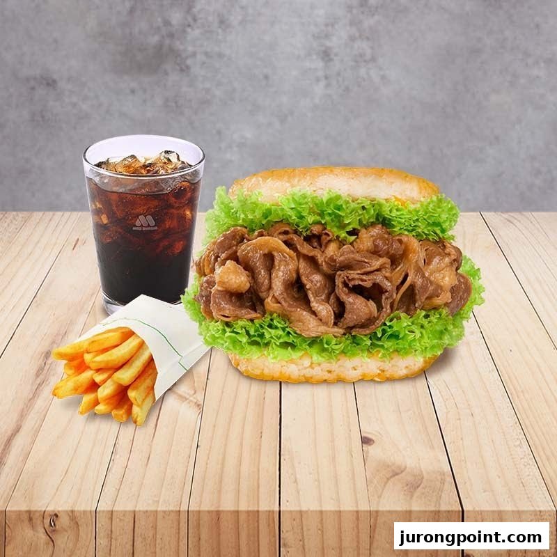 A delicious MOS Burger meal featuring a rice burger with beef, fresh lettuce, fries, and a refreshing drink.