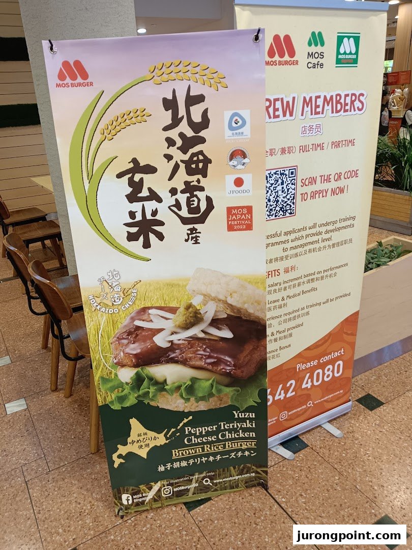 Two promotional banners for MOS Burger, one featuring a Yuzu Pepper Teriyaki Cheese Chicken Brown Rice Burger and another for job recruitment.