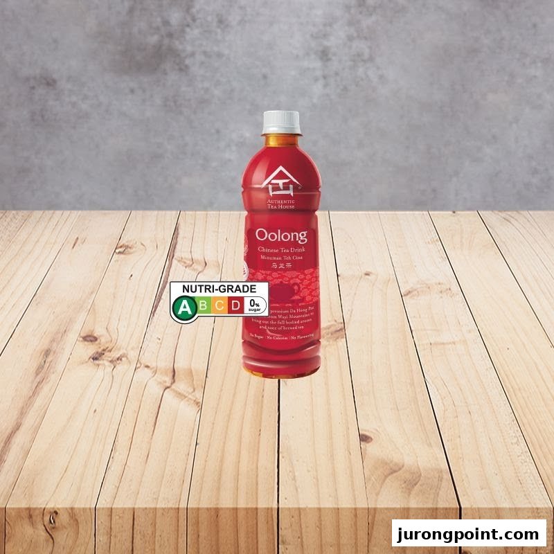 A bottle of Authentic Tea House Oolong Chinese Tea Drink with a Nutri-Grade label on a wooden table.