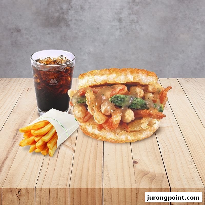 A delicious MOS Burger meal featuring a rice burger, fries, and a refreshing drink on a wooden table.