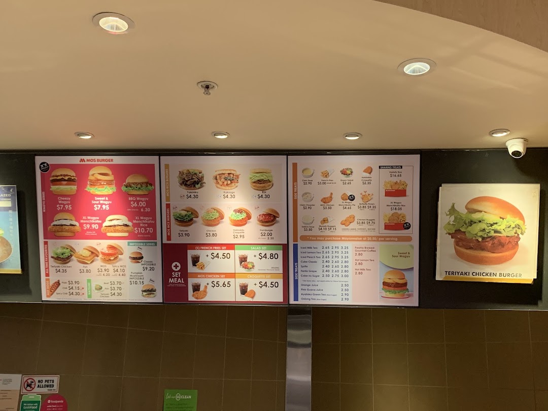 A detailed view of MOS Burger's menu boards showcasing various burgers, sides, drinks, and prices.