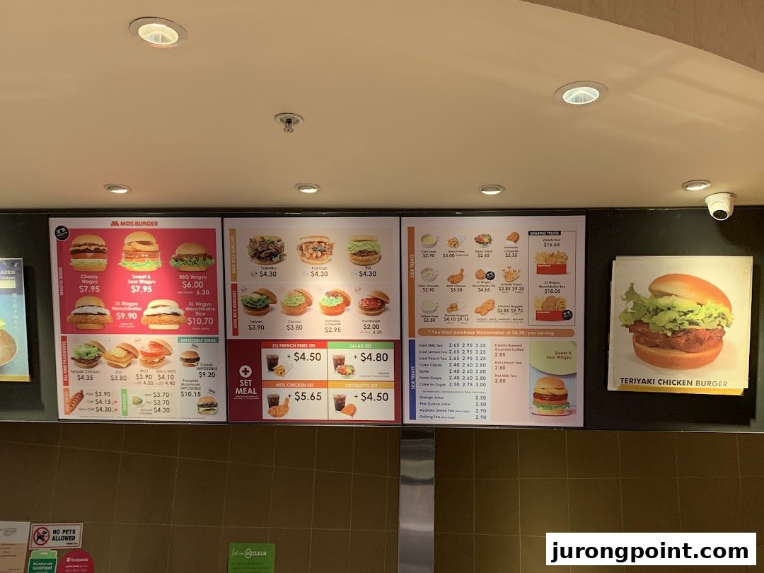 A detailed view of MOS Burger's menu boards showcasing various burgers, sides, drinks, and prices.