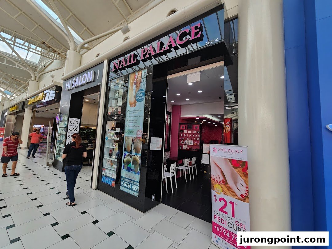Exterior view of Nail Palace and Hi Salon, showcasing their entrances and promotional offers.