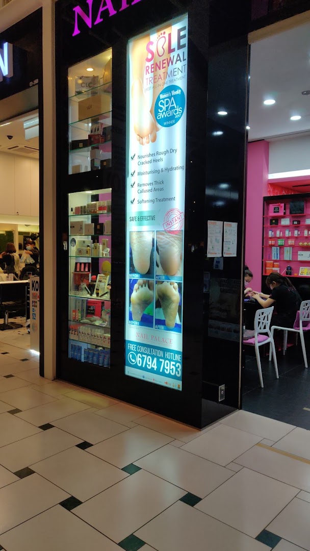 The shop front of Nail Palace features a bright display advertising 'Sole Renewal Treatment' and shows staff attending to customers inside.