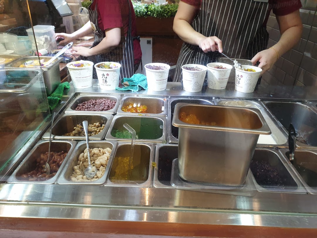 Staff prepare fresh Taiwanese desserts with various toppings at Nine Fresh.
