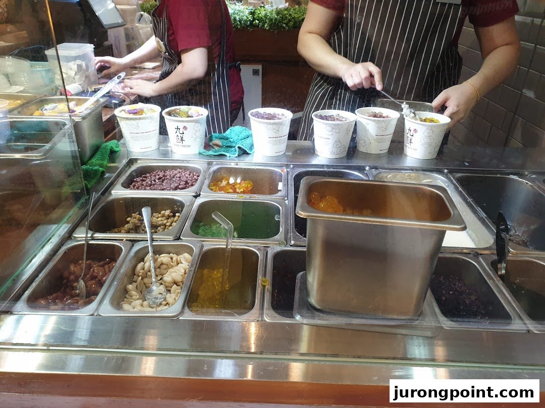 Staff prepare fresh Taiwanese desserts with various toppings at Nine Fresh.
