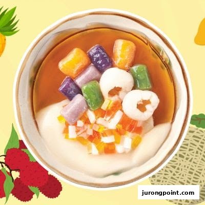 A vibrant bowl of Taiwanese dessert featuring colorful taro balls, lychee, and fruit jellies.