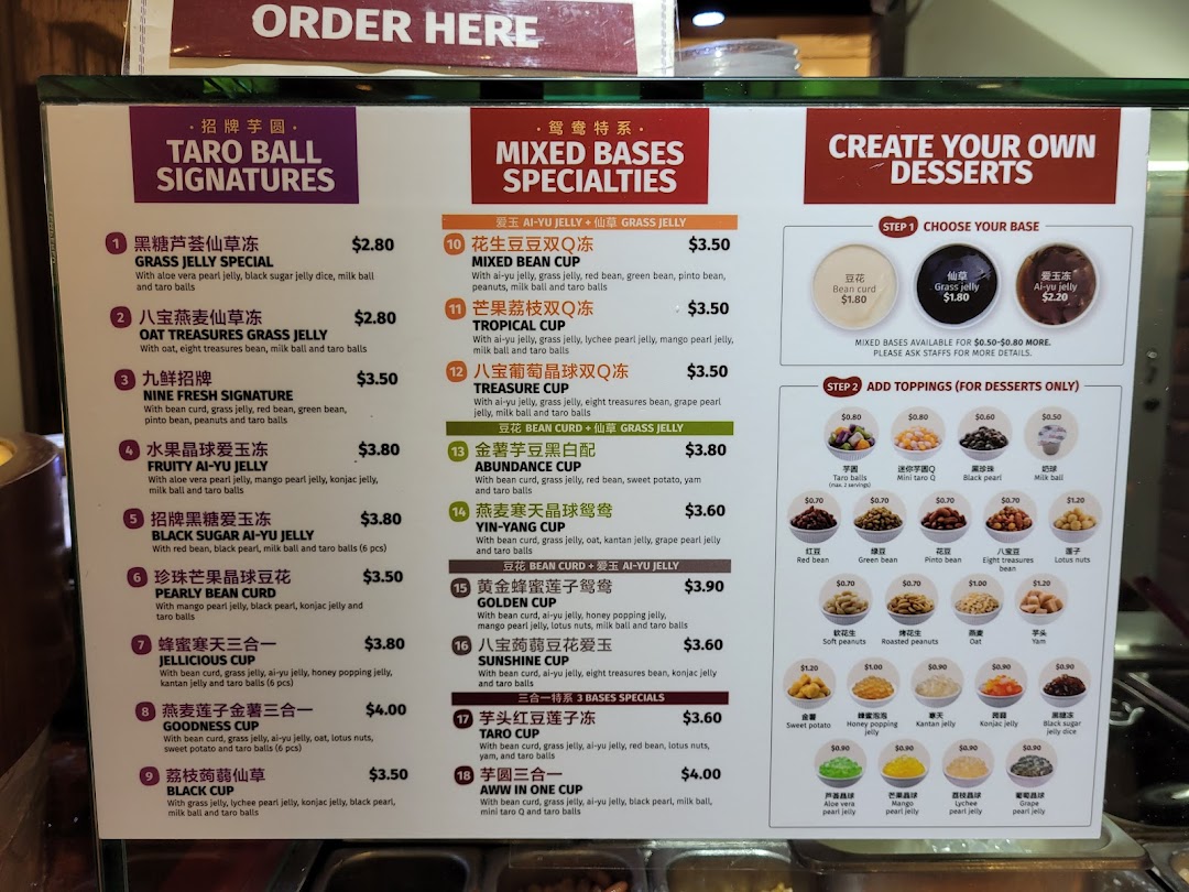 A detailed menu board displaying various Taiwanese desserts, including taro ball signatures and custom options.